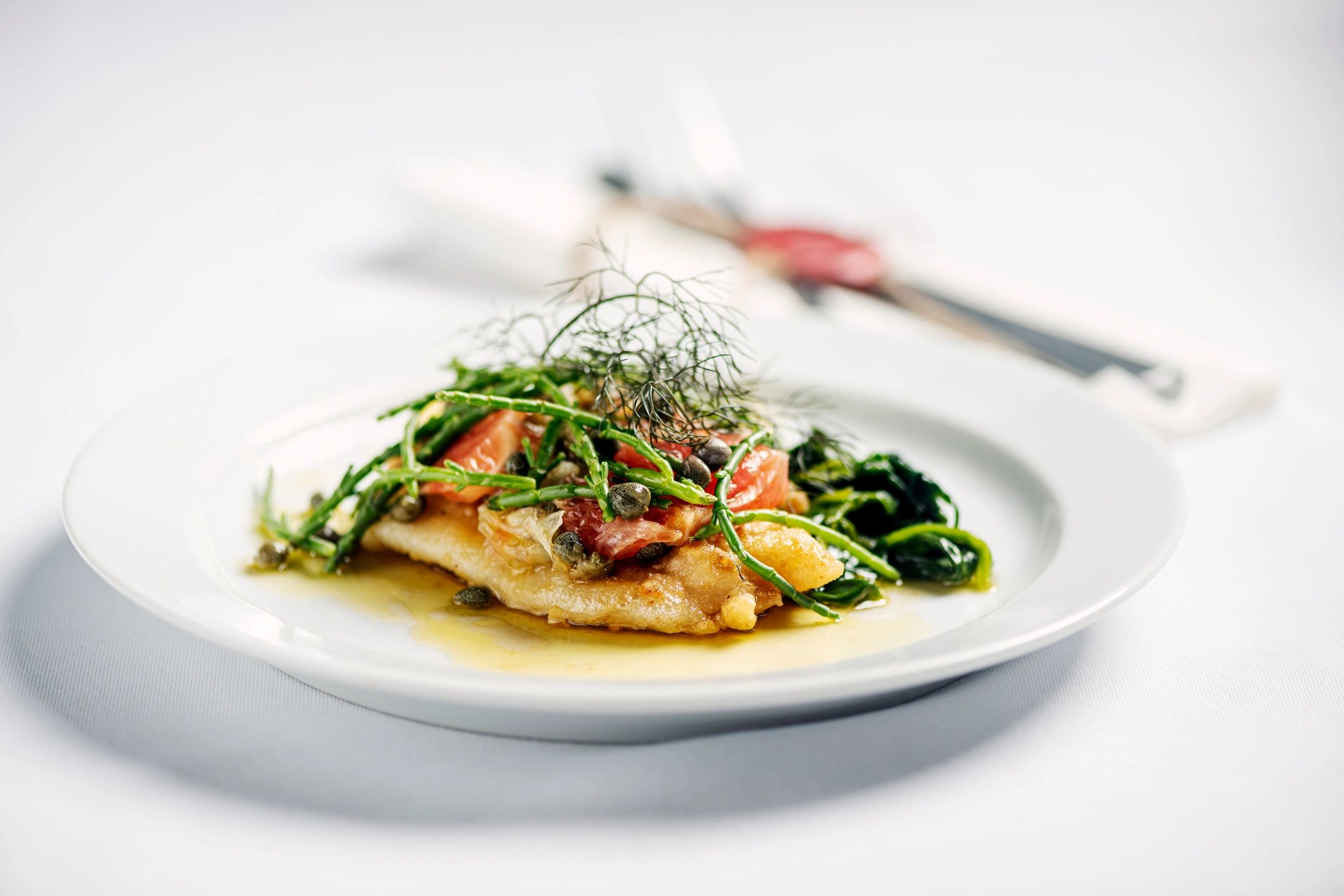 Pan-fried lemon sole with brown butter sauce and greens